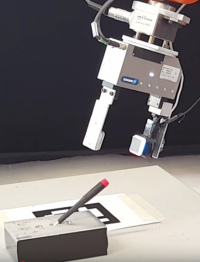 A GelSight sensor attached to a robot’s gripper enables the robot to determine precisely where it has grasped a small screwdriver, removing it from and inserting it back into a slot, even when the gripper screens the screwdriver from the robot’s camera. (credit: Robot Locomotion Group at MIT)
