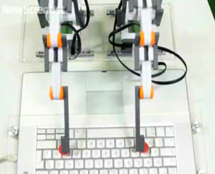 robot arms on keyboard